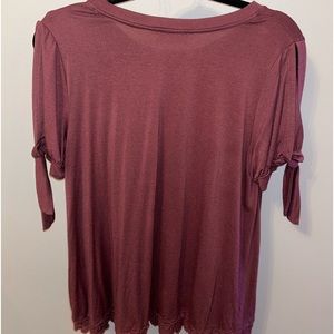 Cute top with cut out shoulders and lace at the bottom and more of redwine color